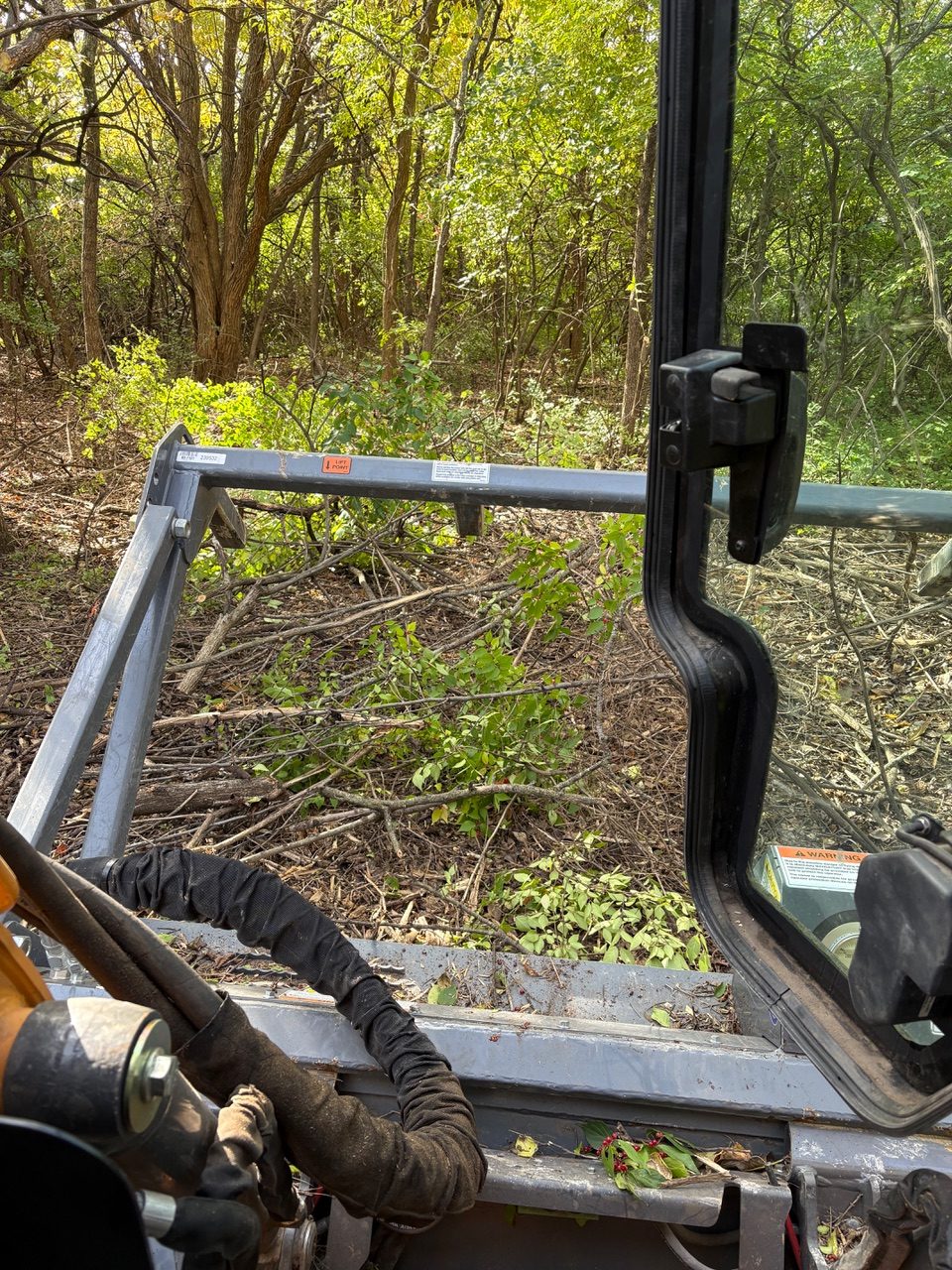 Operator's view from inside the machine while mulching brush